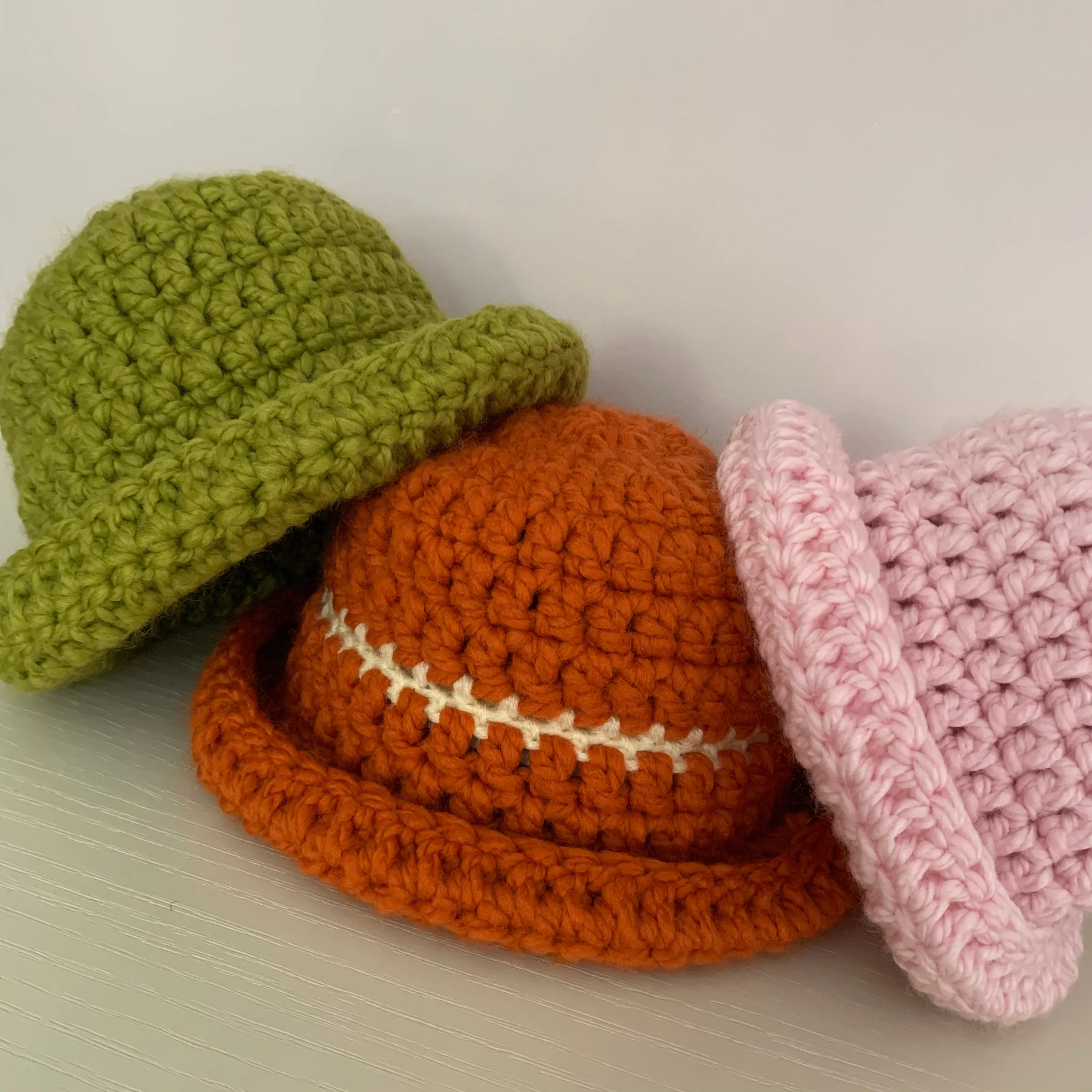 Handmade burnt orange chunky crochet bowler hat with cream stripe