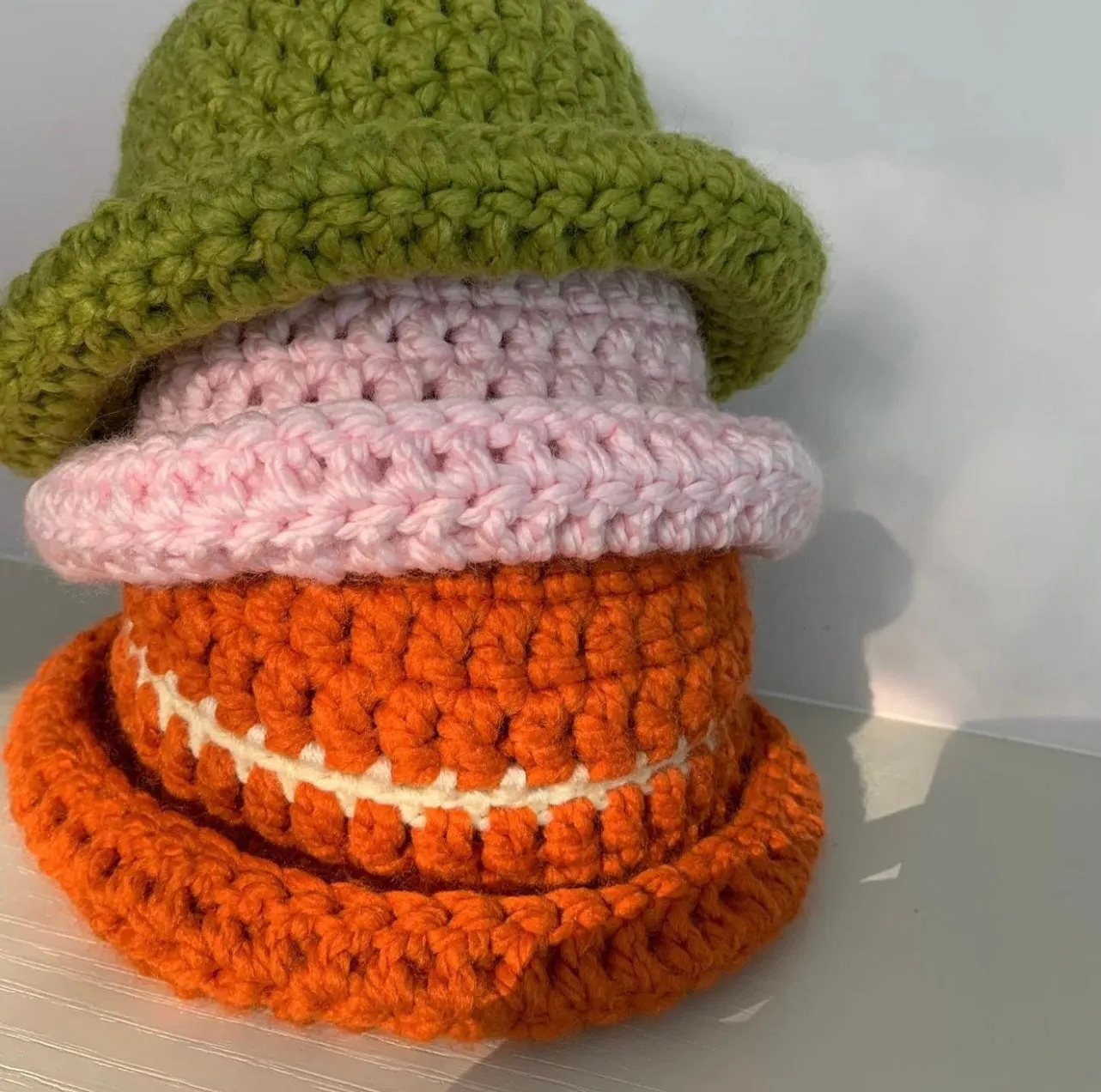 Handmade burnt orange chunky crochet bowler hat with cream stripe