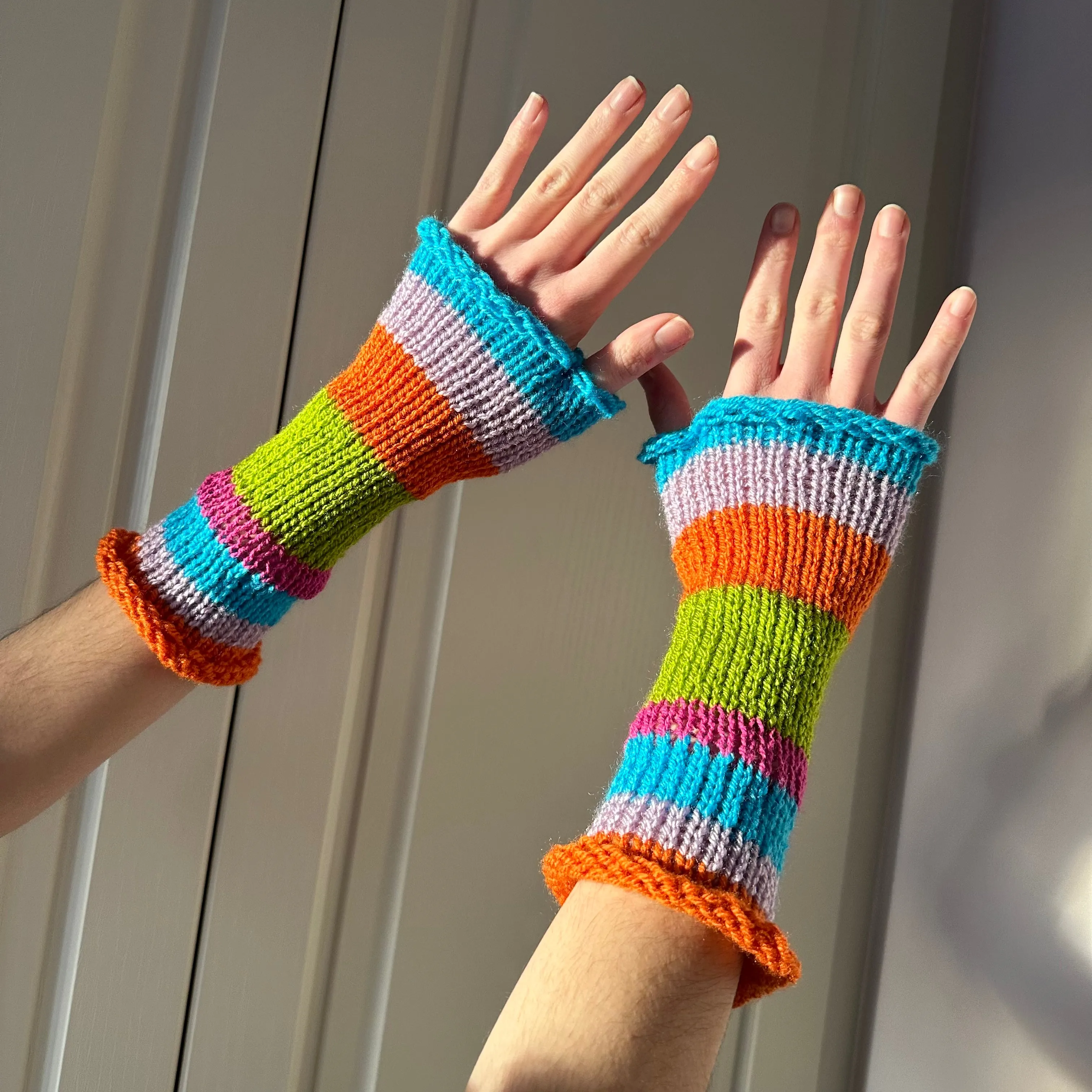 Handmade knitted rainbow striped hand warmers