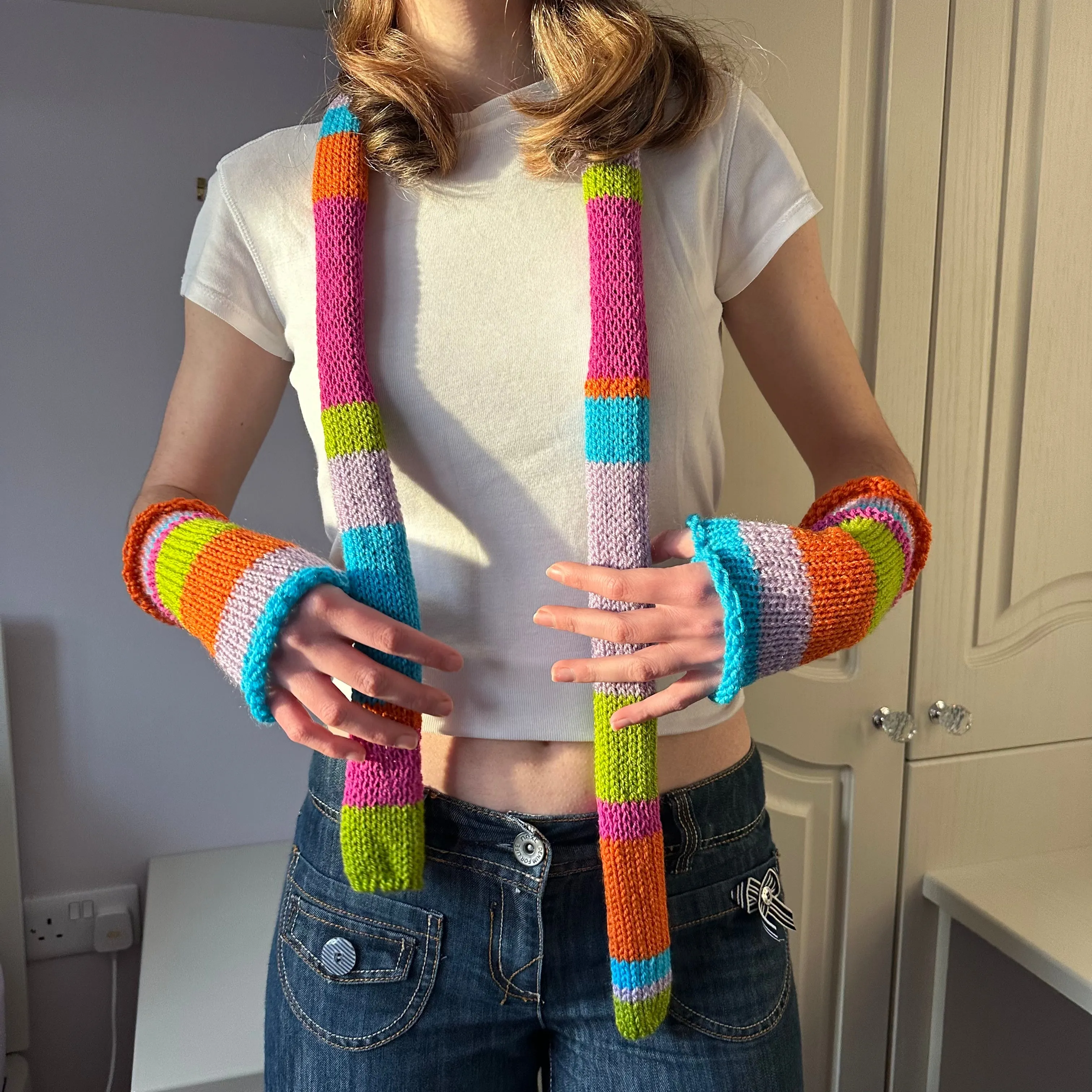 Handmade knitted rainbow striped hand warmers