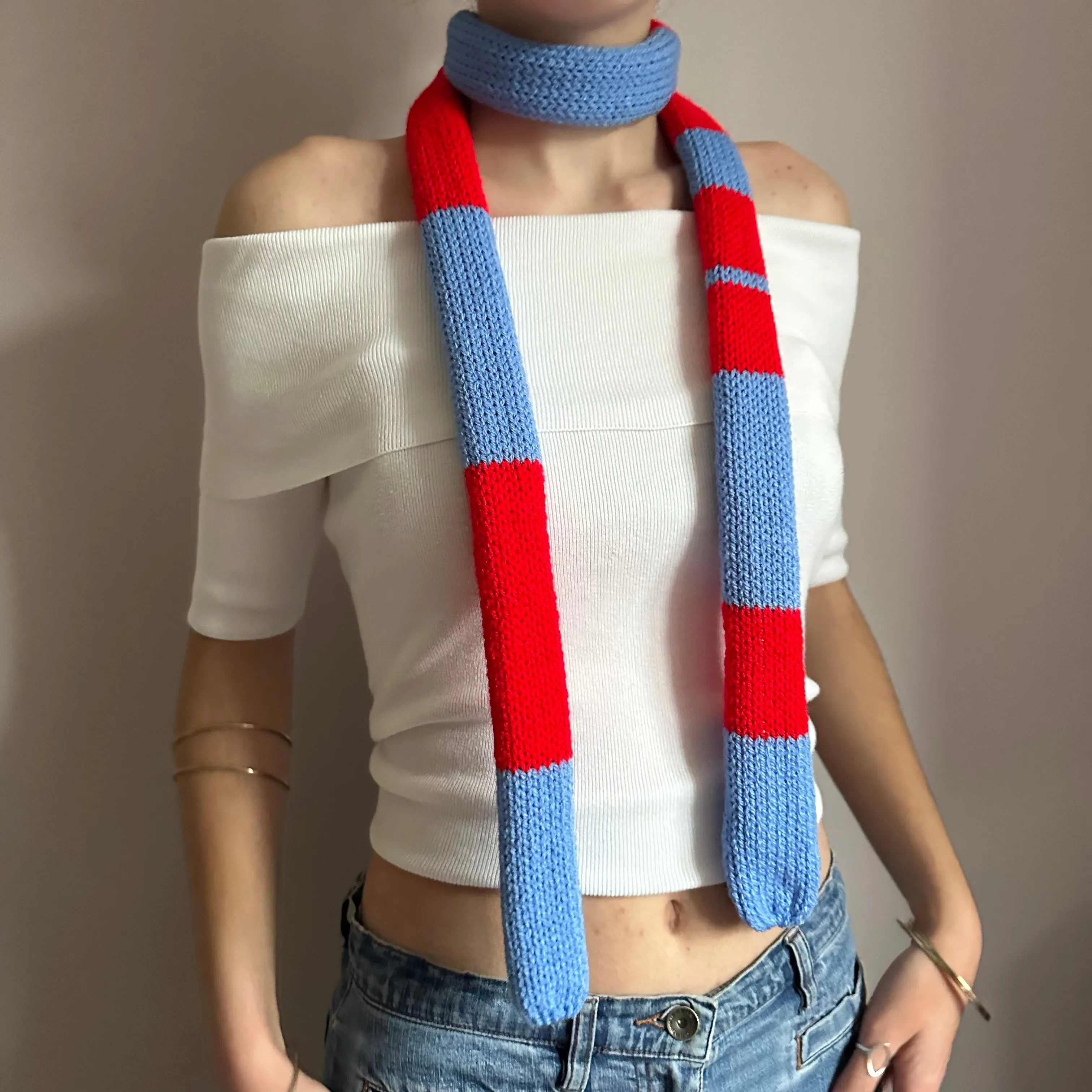 Handmade knitted stripy skinny scarf in red and blue